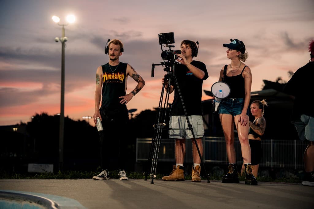 Brendan, Jackson, and Annaya on camera at sunset